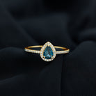 Rosec Jewels-Pear Shaped London Blue Topaz Engagement Ring With Moissanite